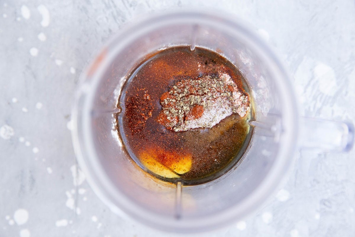 Small blender with marinade ingredients inside, ready to blend.