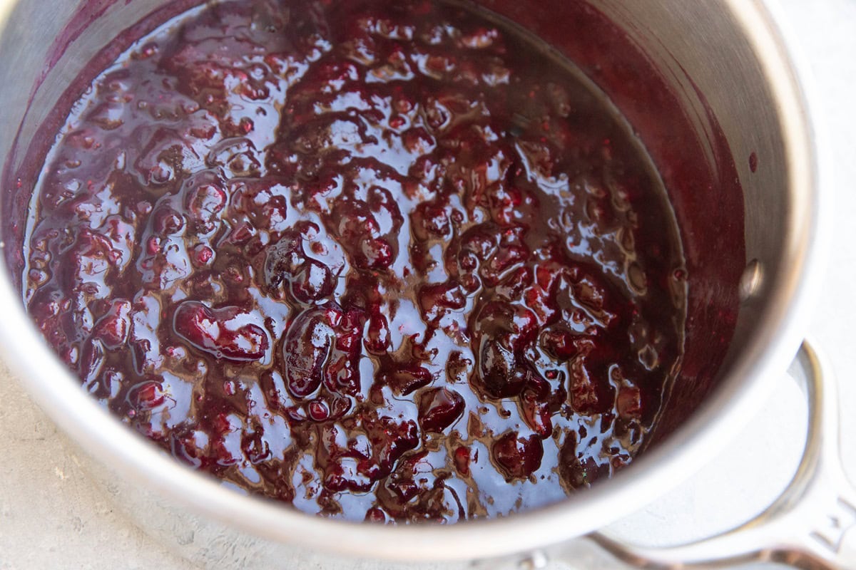 Saucepan with homemade cherry pie filling inside.
