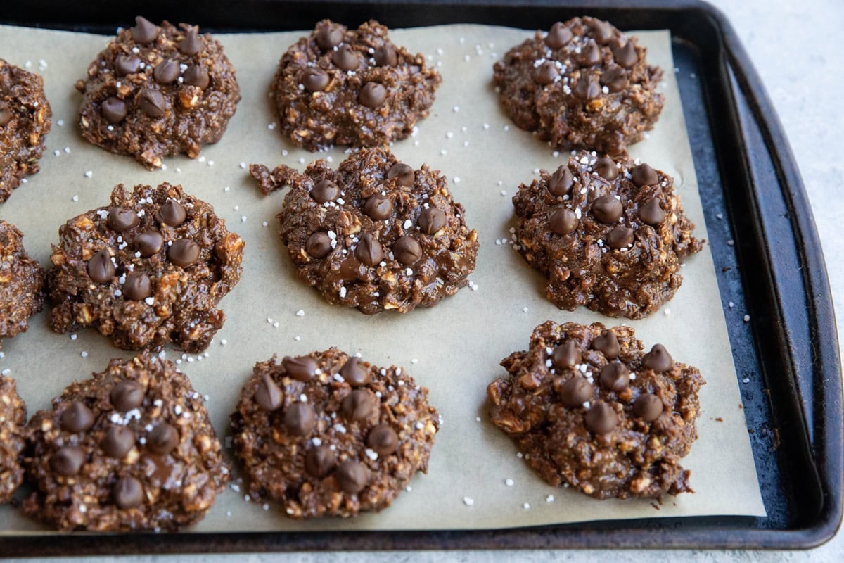 Cookie sheet lined with parchment and no-bake cookie dough on top, ready to freeze.