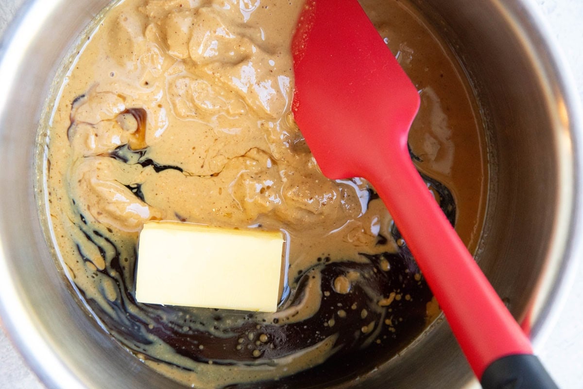 Wet ingredients for no-oat no-bake cookies in a saucepan.