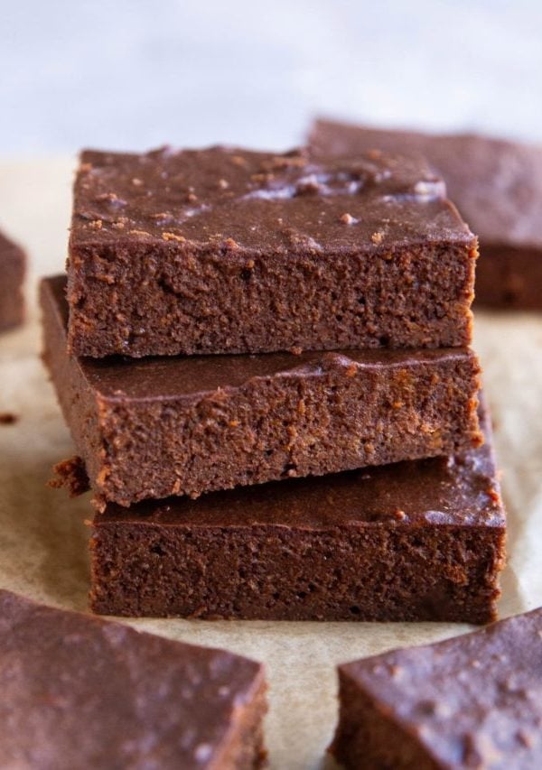Stack of three protein brownies with other brownies to the side