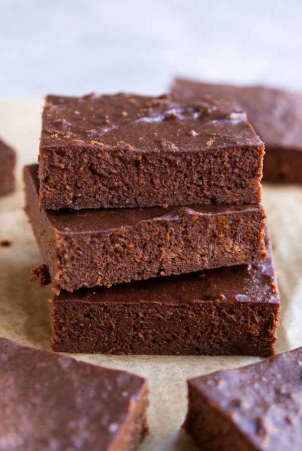 Stack of three protein brownies with other brownies to the side