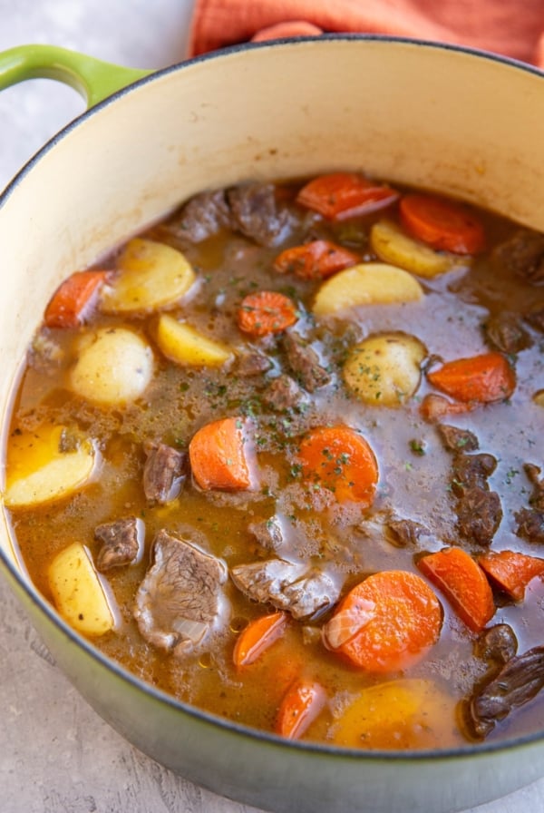 Big pot of beef stew with carrots and potatoes. Ready to serve.