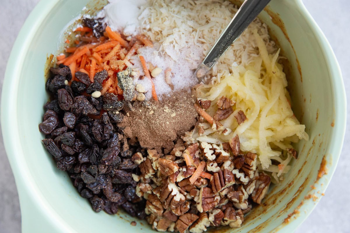Large mixing bowl full of ingredients for almond flour carrot breakfast bars.
