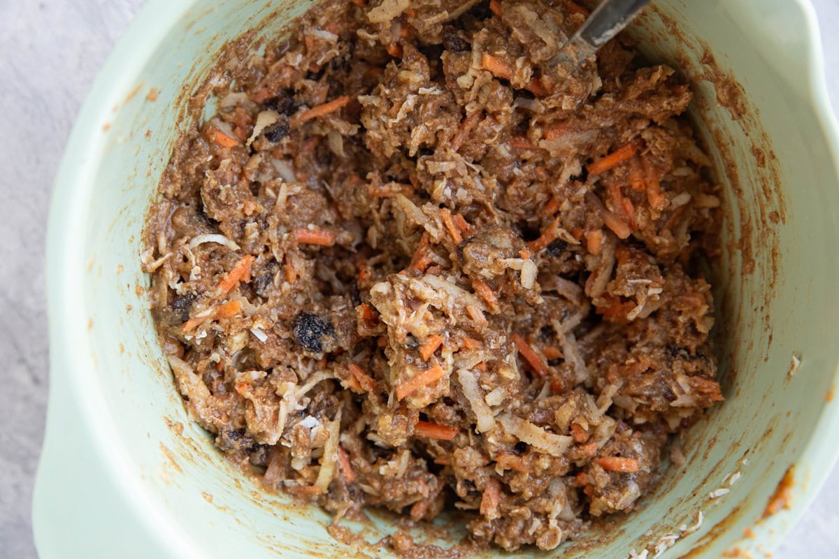 Mixing bowl full of carrot cake mixture to be turned into breakfast bars.