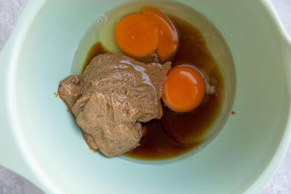 Wet ingredients for carrot cake breakfast bars in a bowl.