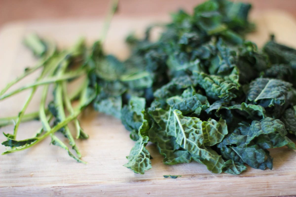 Chopped kale on a cutting board, ready to use.