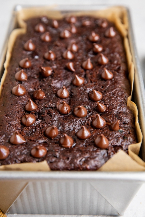 Loaf pan of almond flour chocolate bread, fresh out of the oven.