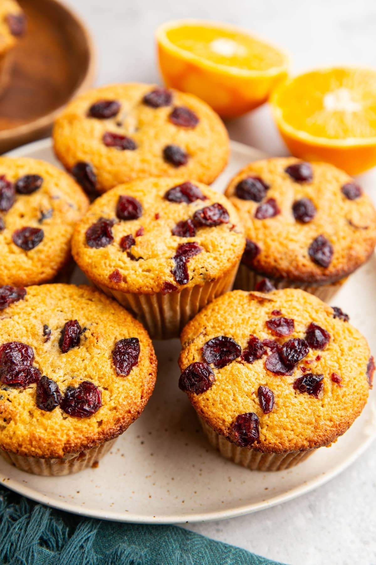 Plate full of cranberry orange muffins, ready to serve.