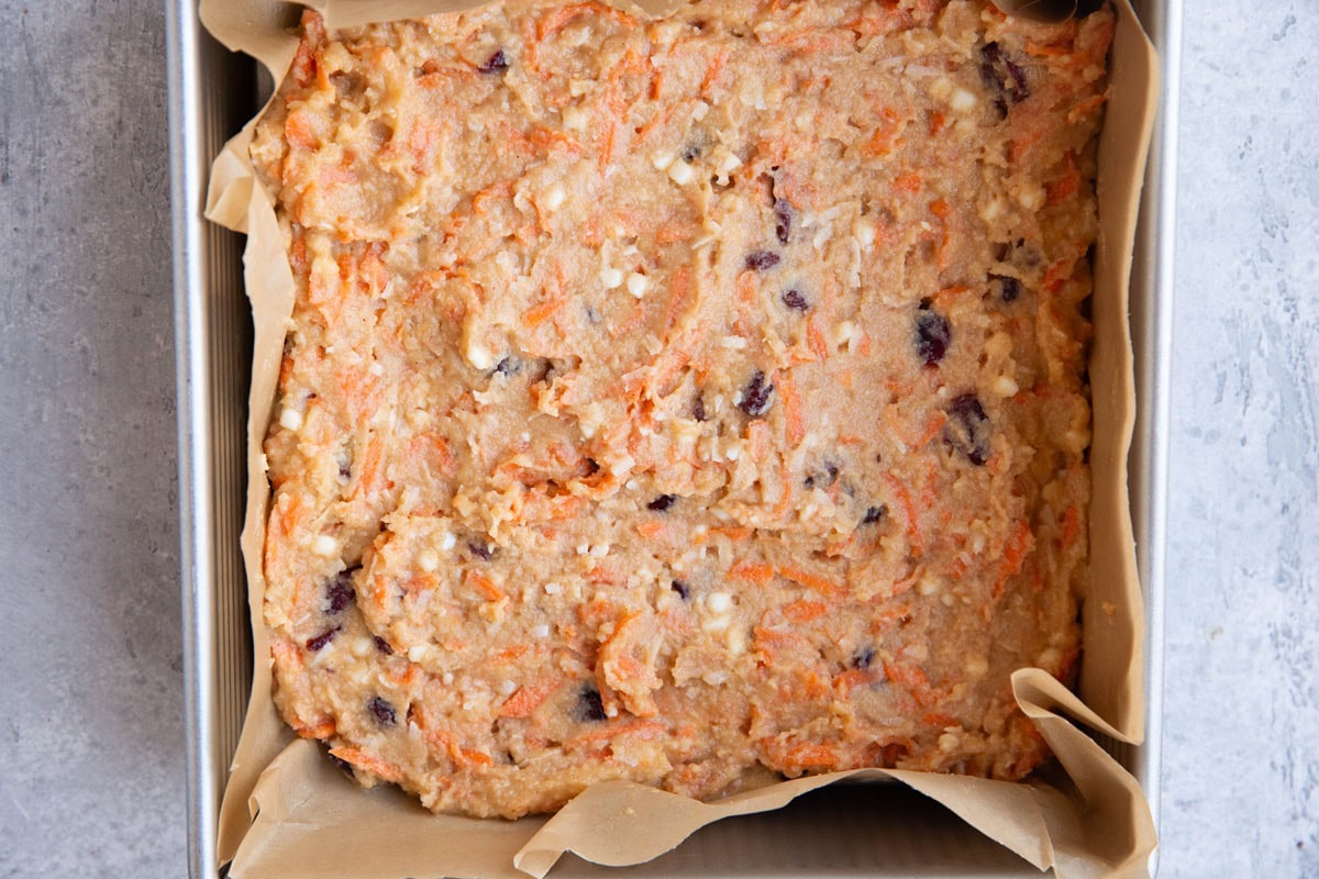 Cake pan with carrot cake batter ready to go into the oven.