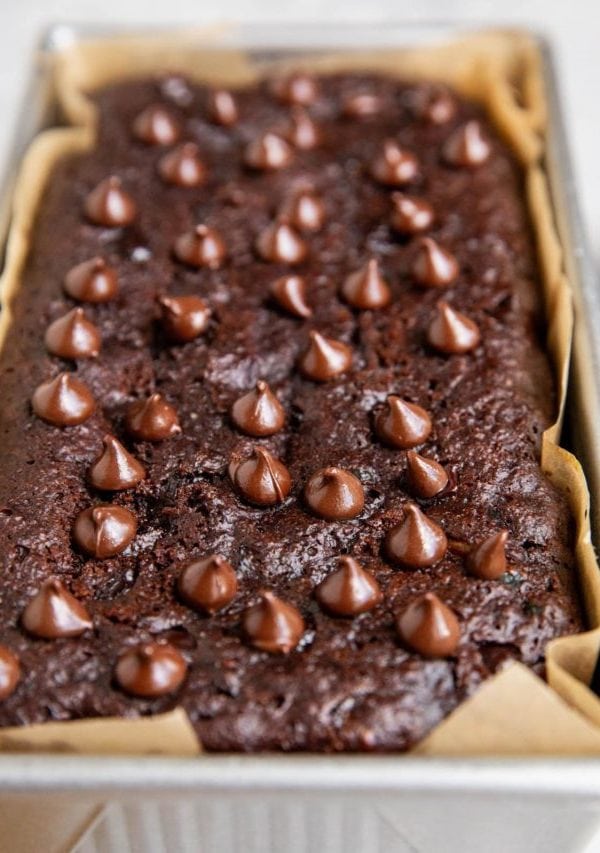 Loaf pan of almond flour chocolate bread, fresh out of the oven.