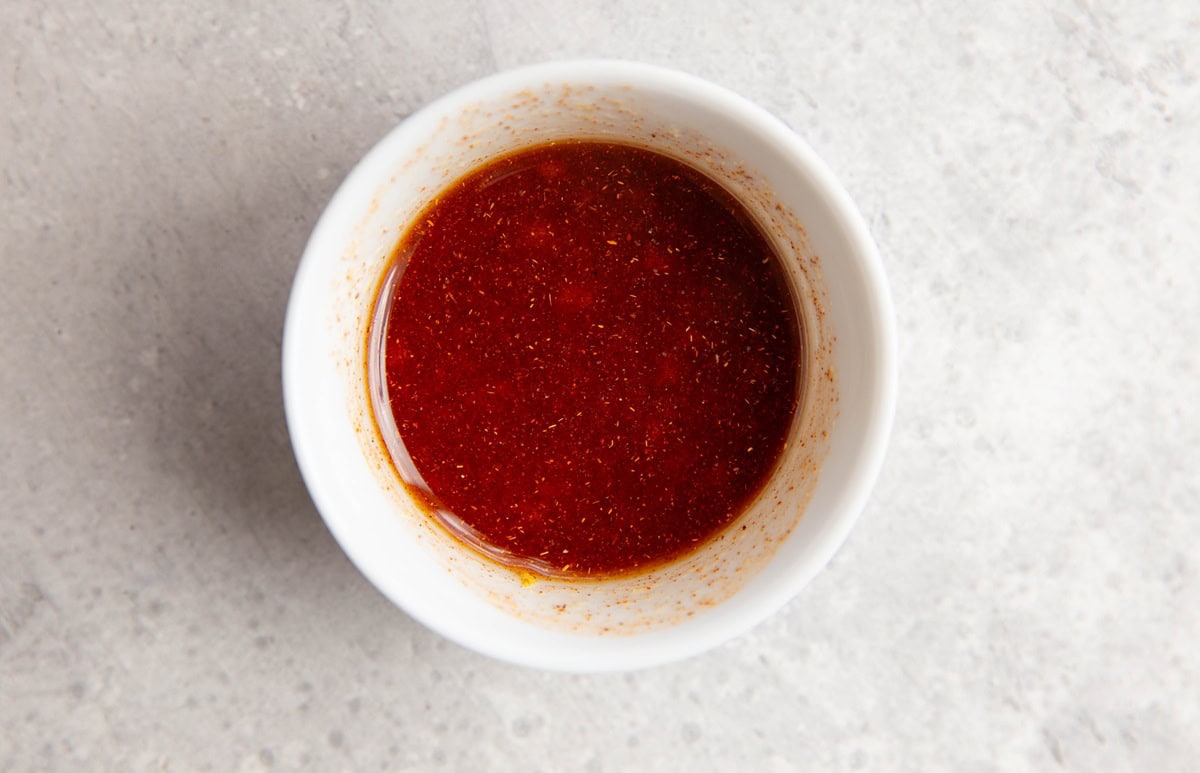 Marinade for salmon in a small bowl