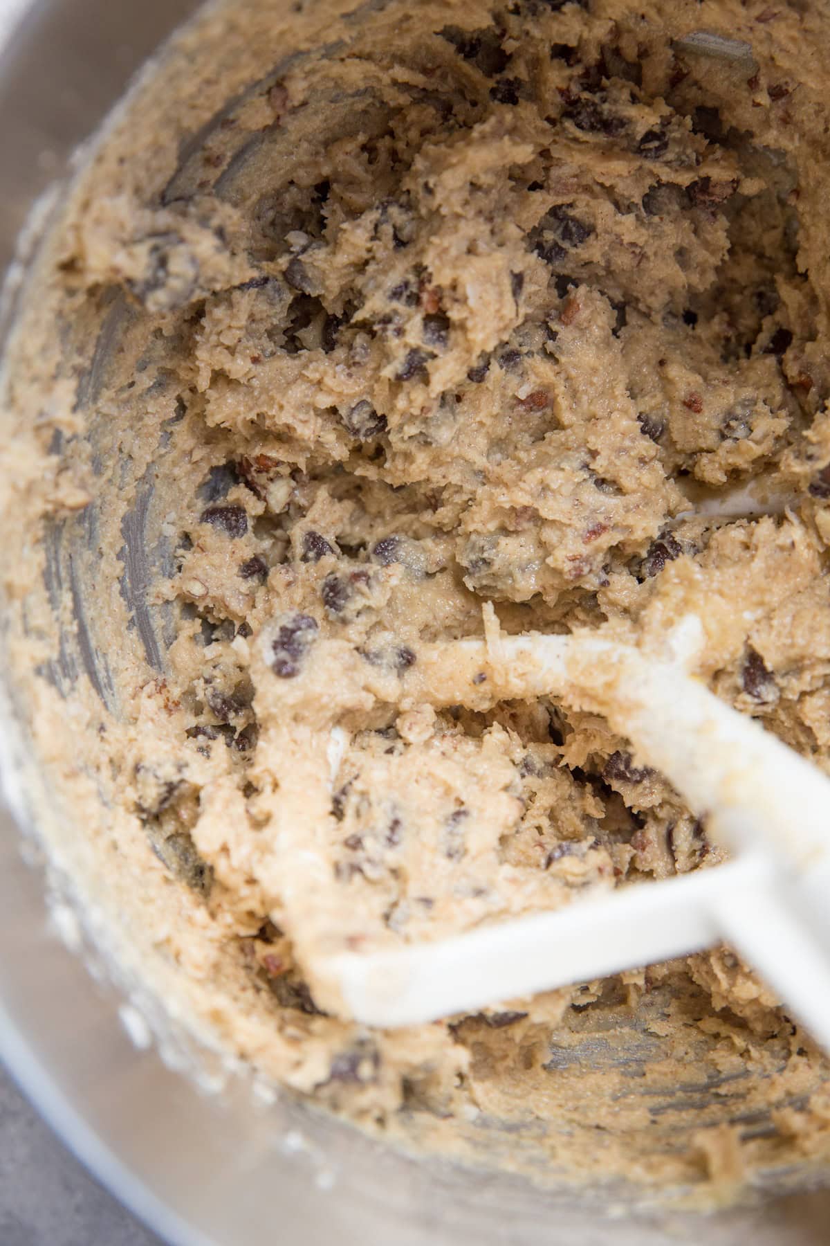 Cowboy cookie dough in a mixing bowl, ready to be baked.