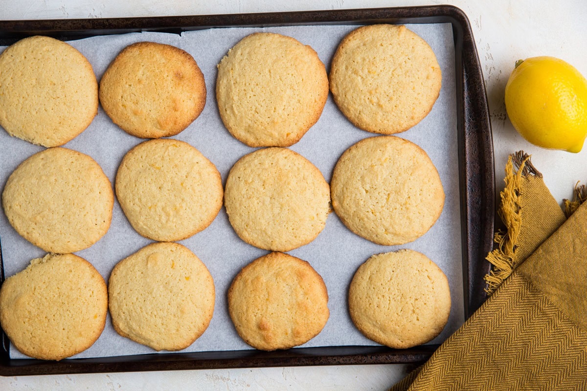 Cookie sheet with lemon cookies on top, fresh out of the oven and ready to use.