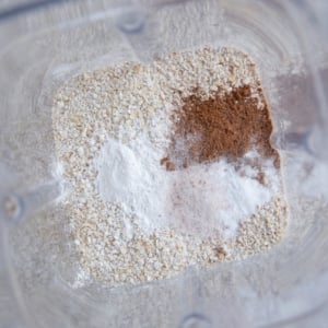 Oats, cinnamon, baking powder, and sea salt in a blender to be blended into a flour.