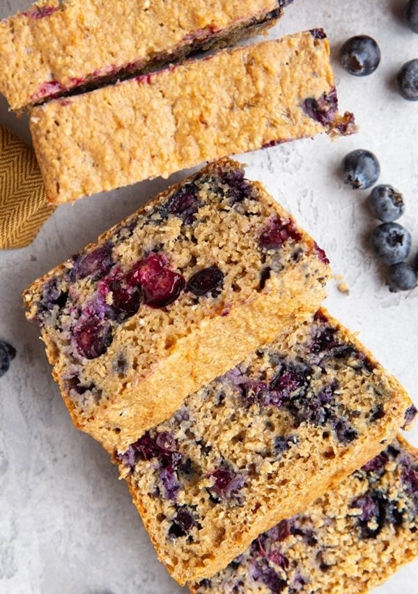 Loaf of blueberry cottage cheese bread cut into slices.