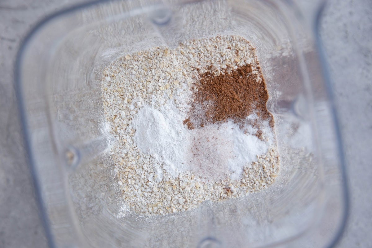 Oats, cinnamon, baking powder, and sea salt in a blender to be blended into a flour.