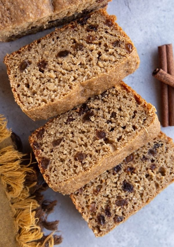Loaf of cinnamon raisin bread cut into slices.
