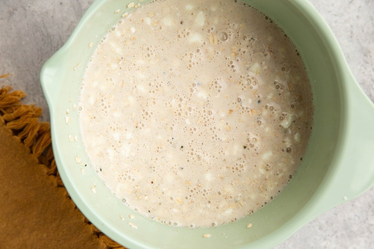 Cottage cheese overnight oat ingredients in a mixing bowl, ready to be stored overnight.