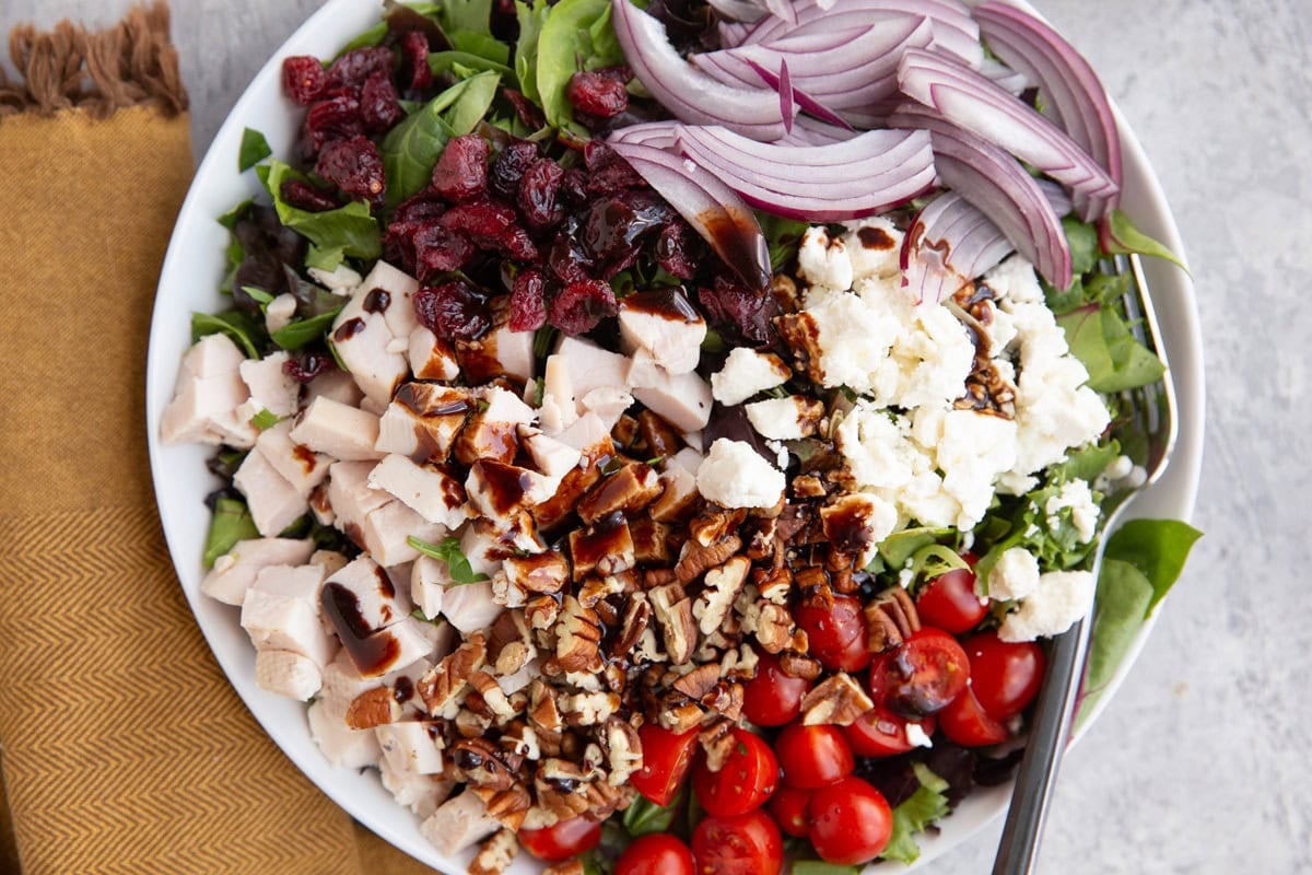 Large bowl full of spring green salad.