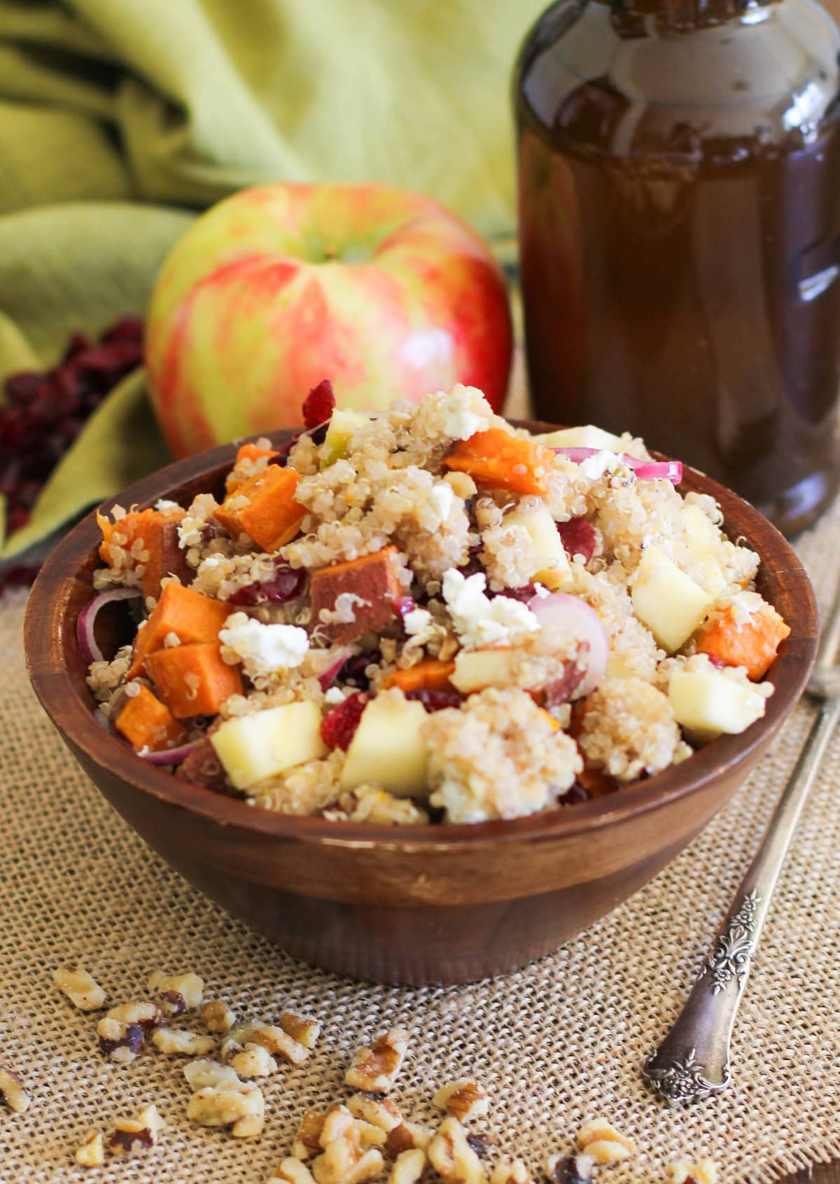 Big bowl full of roasted sweet potato quinoa salad with walnuts and other goodies.