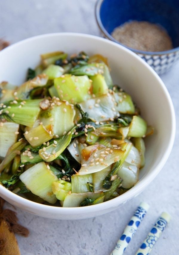 Sauteed Bok Choy in a bowl with sesame seeds sprinkled on top