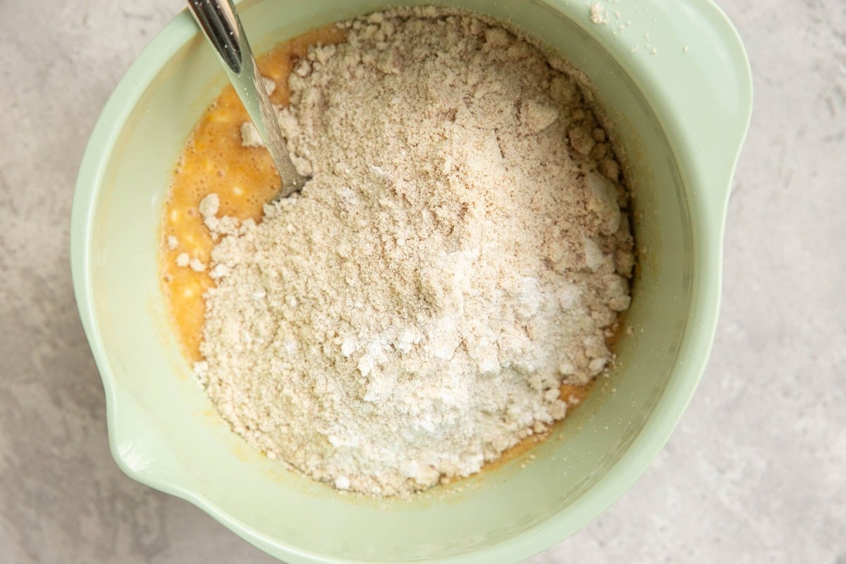 Dry ingredients on top of wet ingredients in a large mixing bowl.