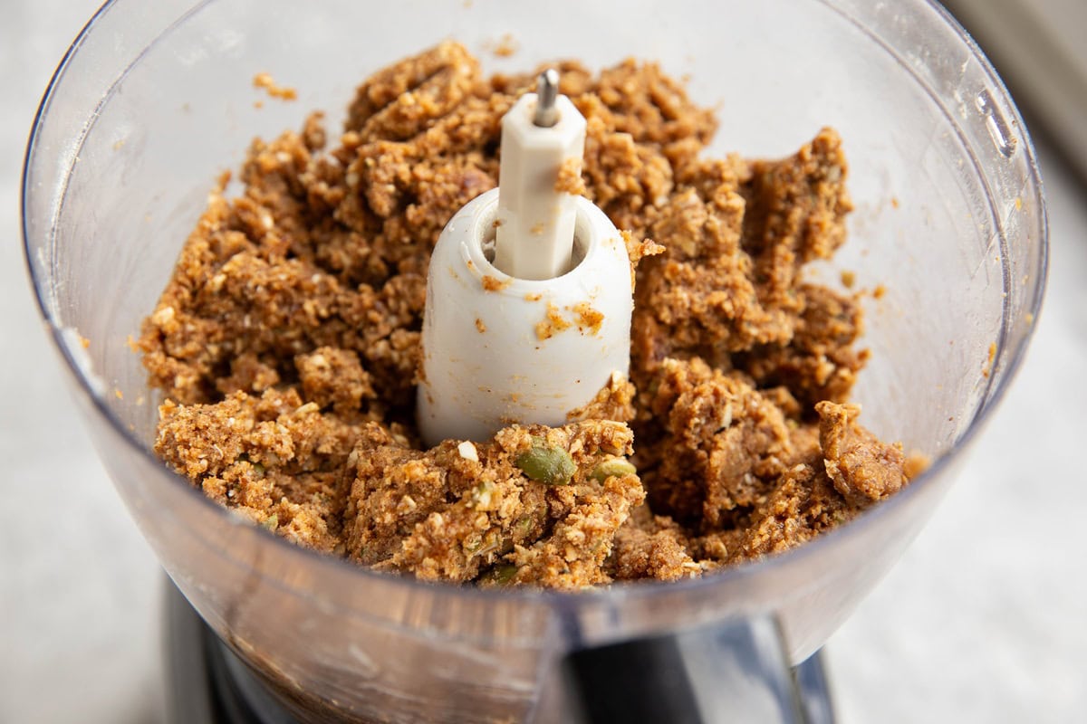 Energy bite mixture in a food processor, ready to form into bites.