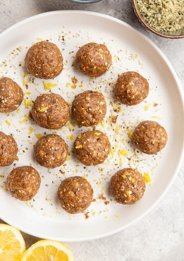 Lemon poppyseed protein balls on a plate, ready to eat.