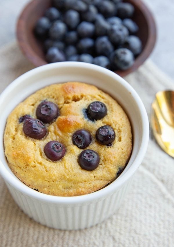 Almond flour blueberry muffin in a ramkein for one person.