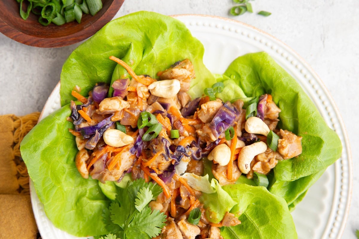 Thai chicken lettuce wraps on a plate, ready to serve.