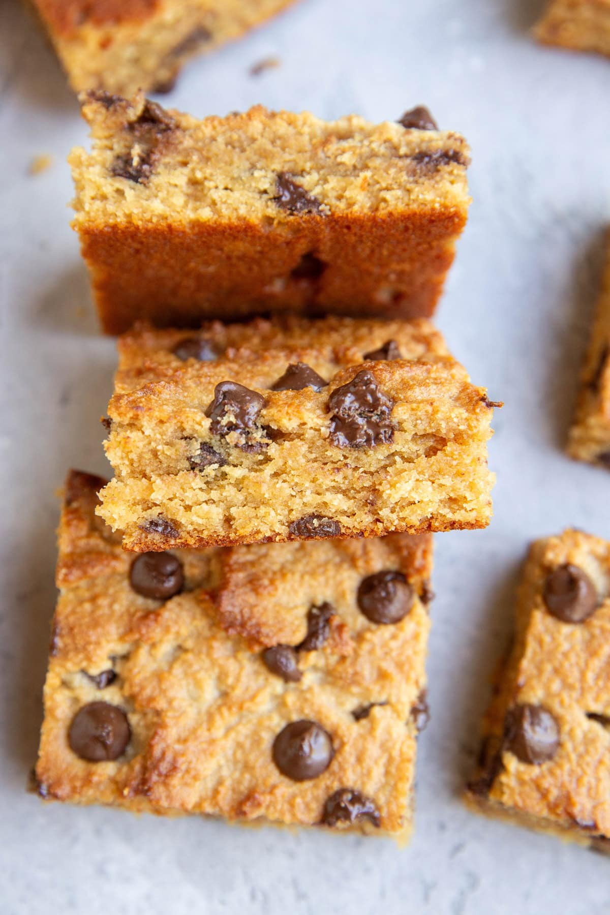 Stack of peanut butter bars fallen over, showing the centers of the bars.