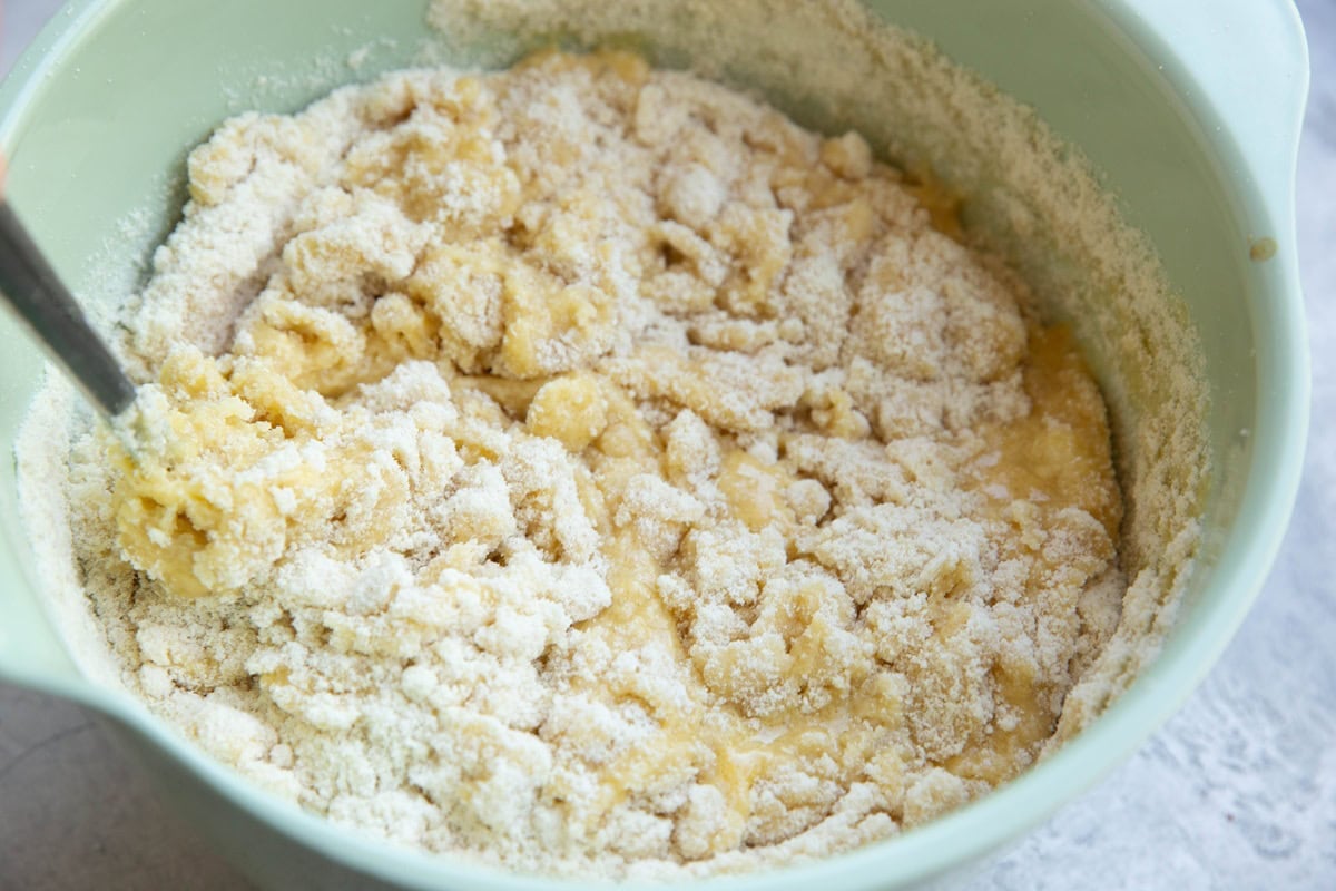 Mixing bowl with cake batter being mixed up.