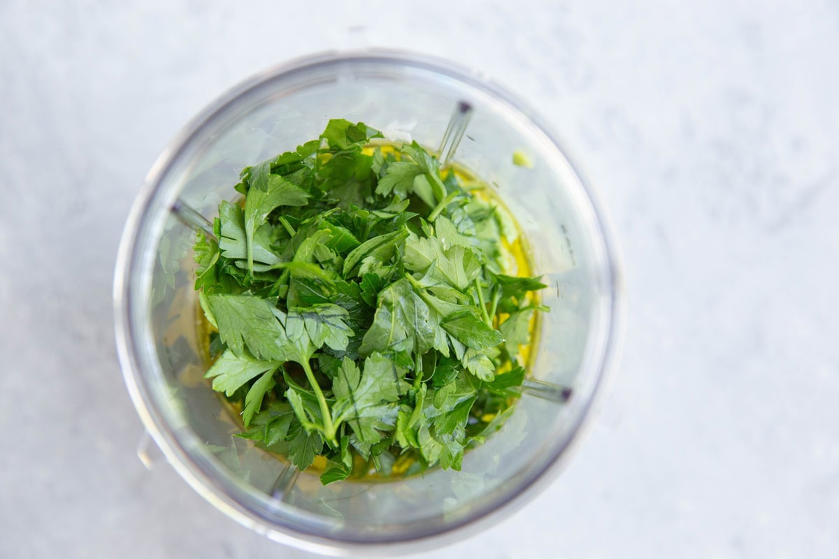 Avocado dressing ingredients in a small blender, ready to be blended.