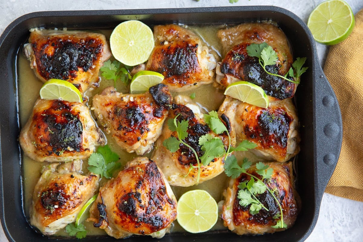 Baking dish with tequila lime chicken thighs inside.