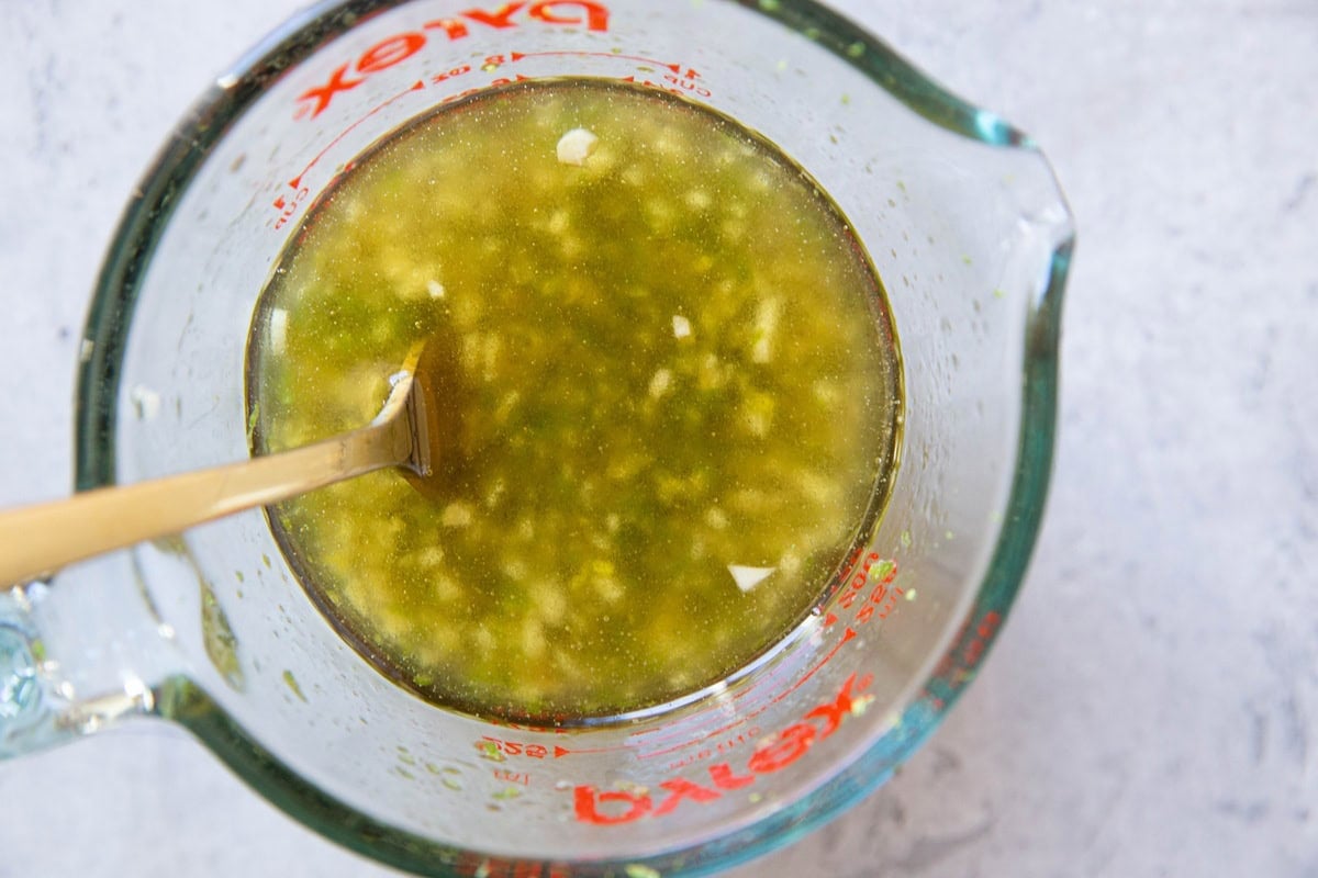 Tequila lime chicken marinade in a measuring cup