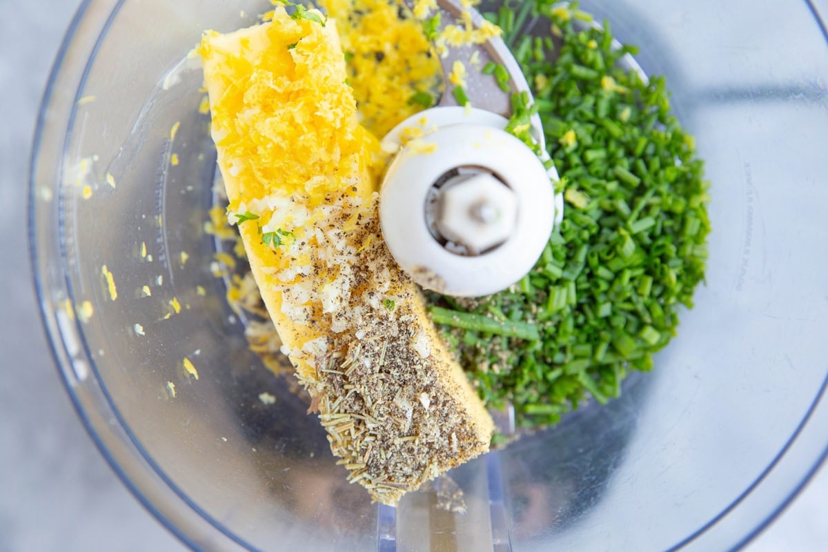 Compound butter ingredients in a food processor.