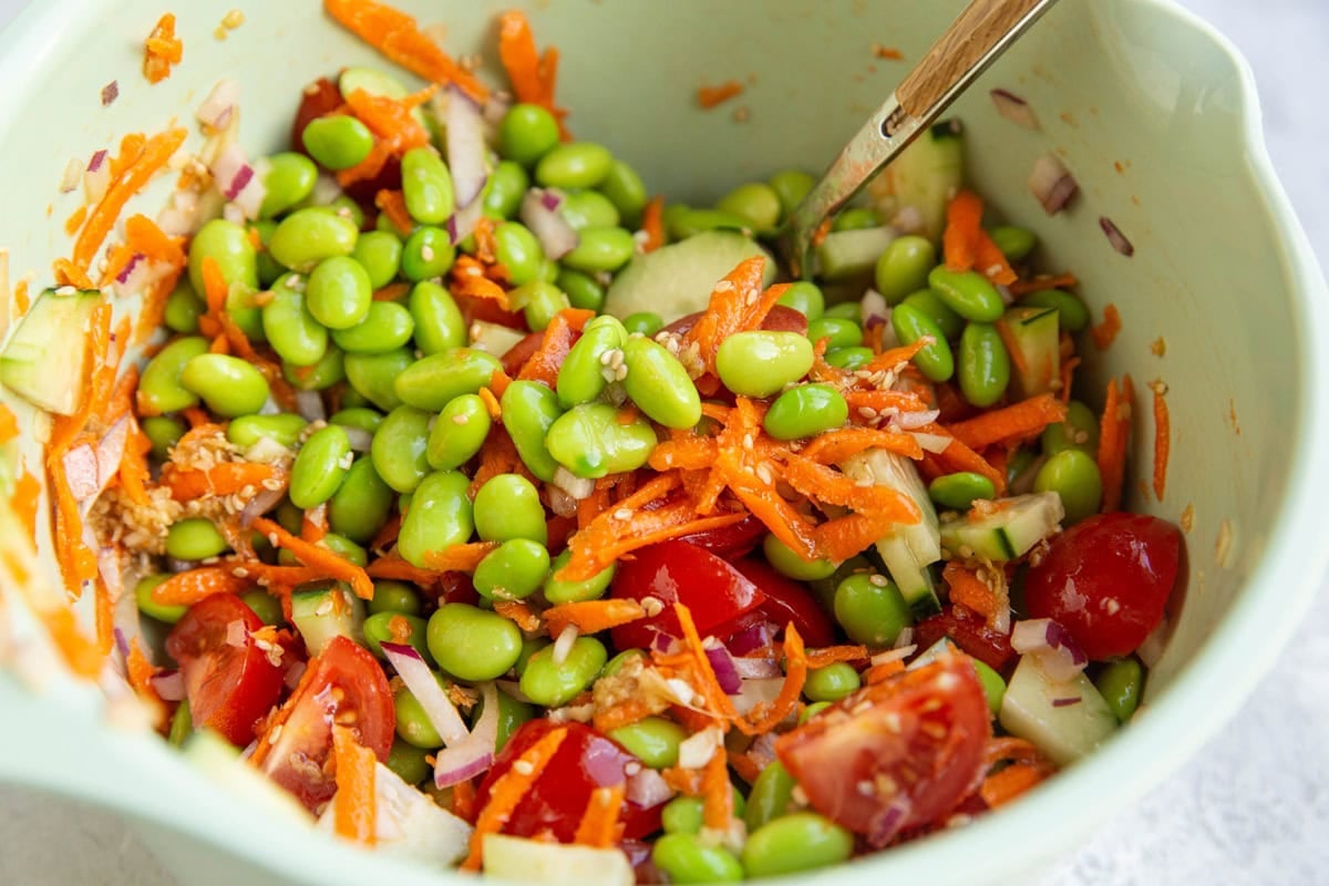 Edamame salad in a mixing bowl, ready to serve.