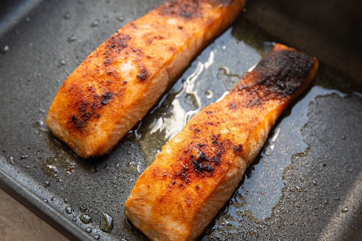 Large casserole dish with cooked salmon inside. Ready to serve.