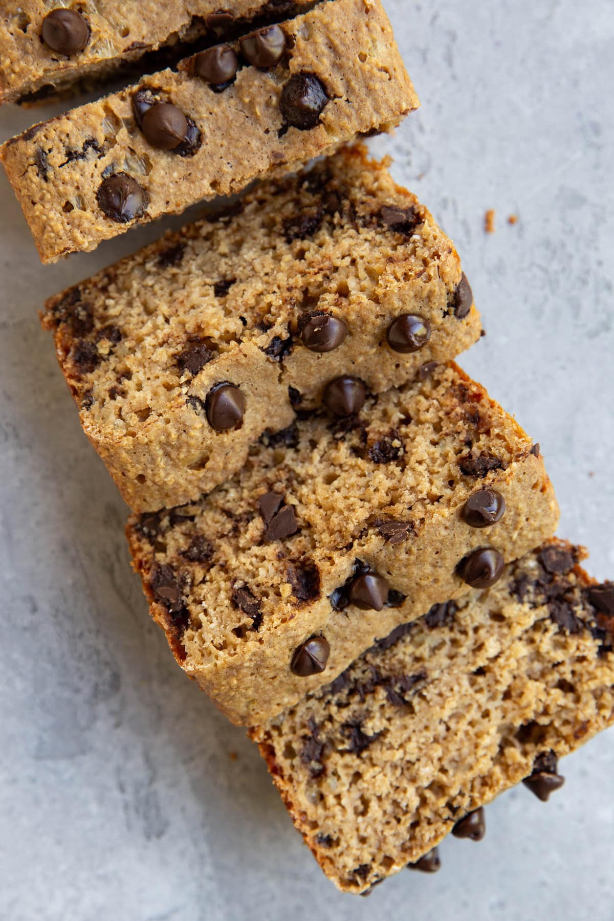 Loaf of chocolate chip bread, cut into slices.