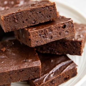 Plate of cottage cheese brownies cut into squares.