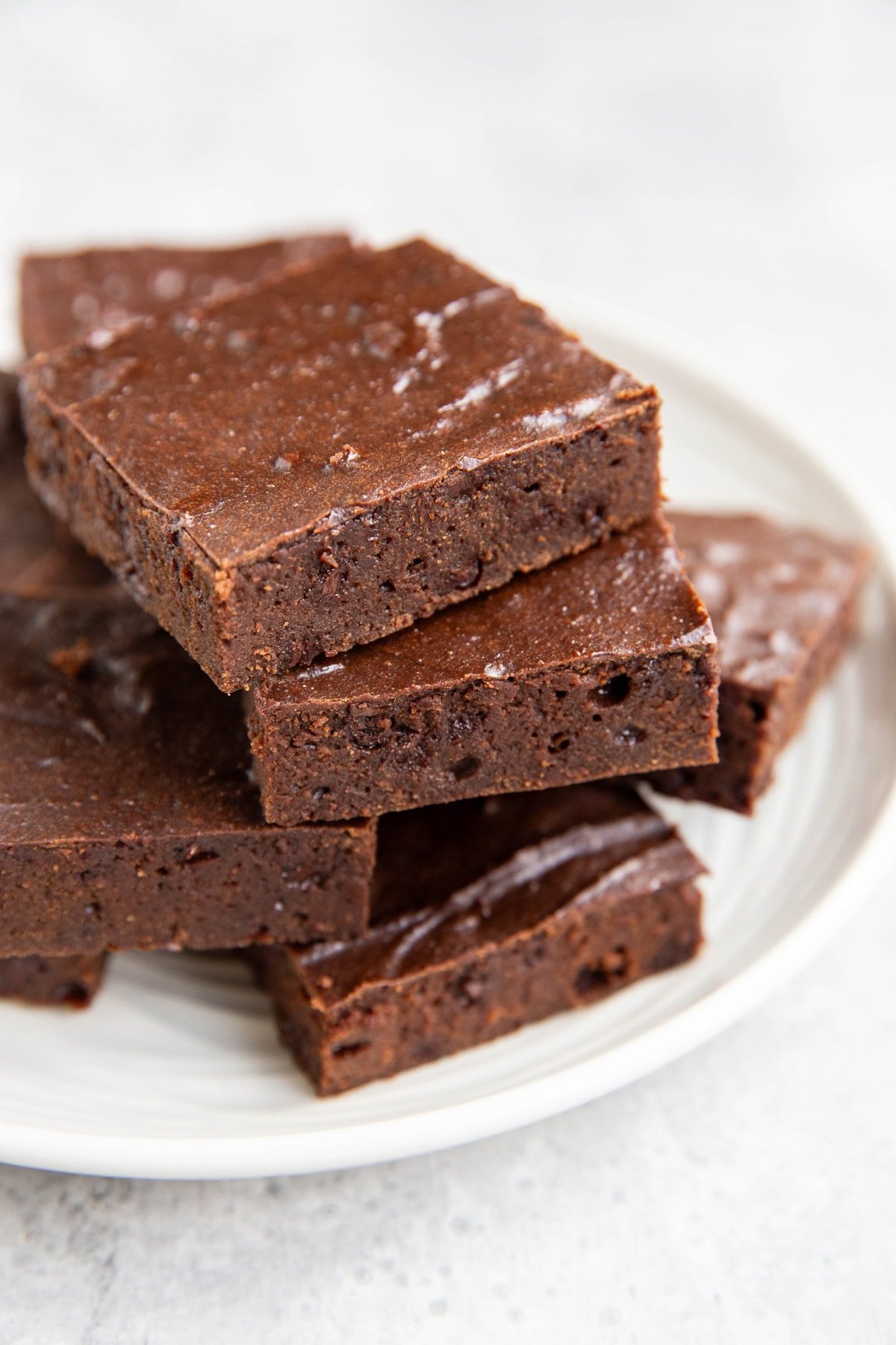 Plate of cottage cheese brownies cut into slices.