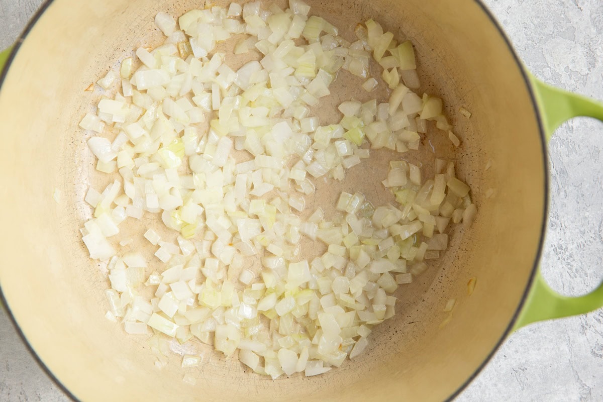 Onions cooking in a Dutch oven.