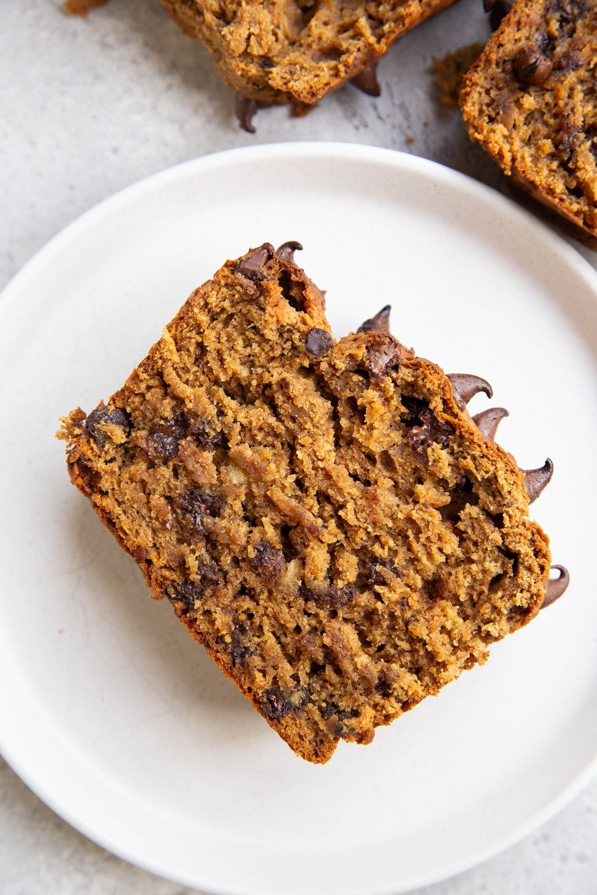 Slice of peanut butter banana bread on a plate, ready to serve.