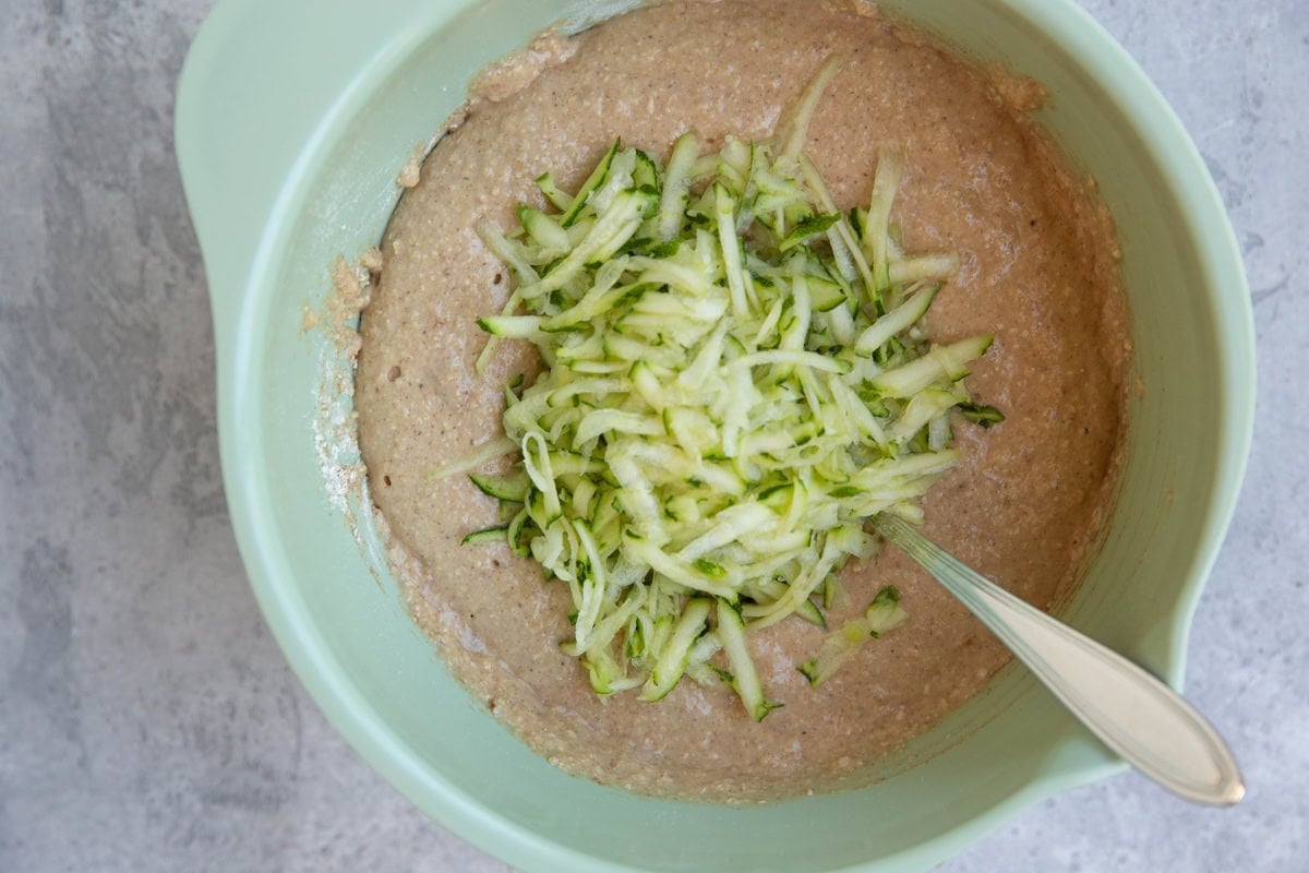 Grated zucchini on top of bread batter, to be mixed in.