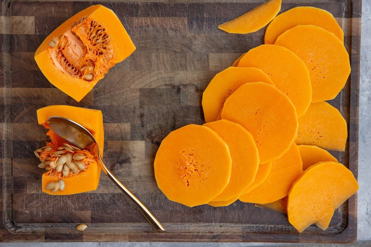 Sliced butternut squash on a wooden cutting board