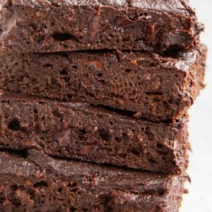 Close up on a stack of four pumpkin brownies.