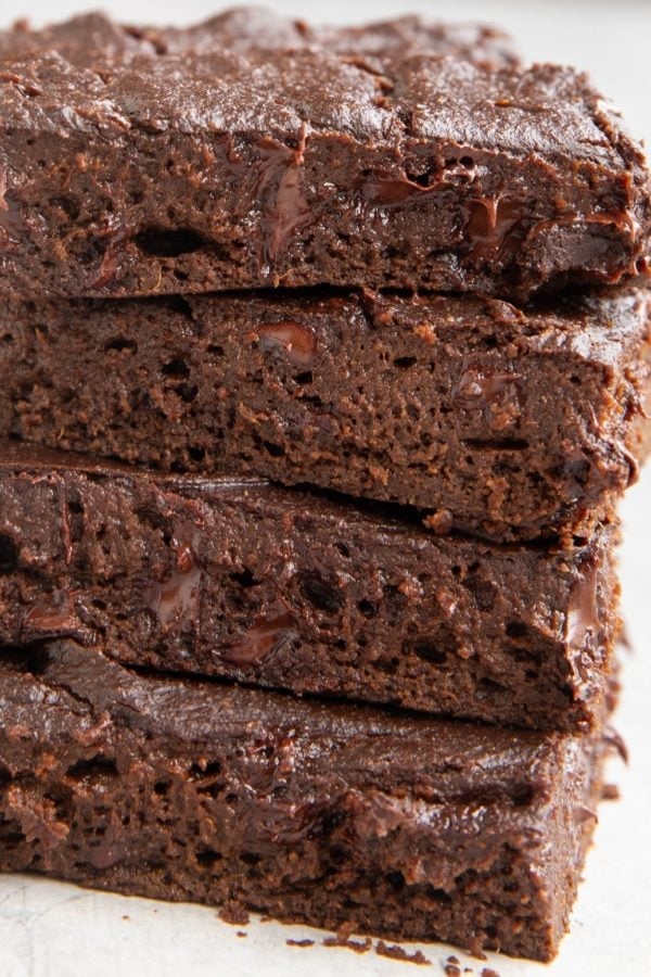 Close up on a stack of four pumpkin brownies.