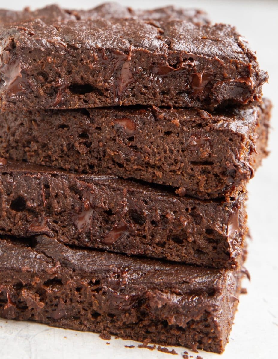 Close up on a stack of four pumpkin brownies.