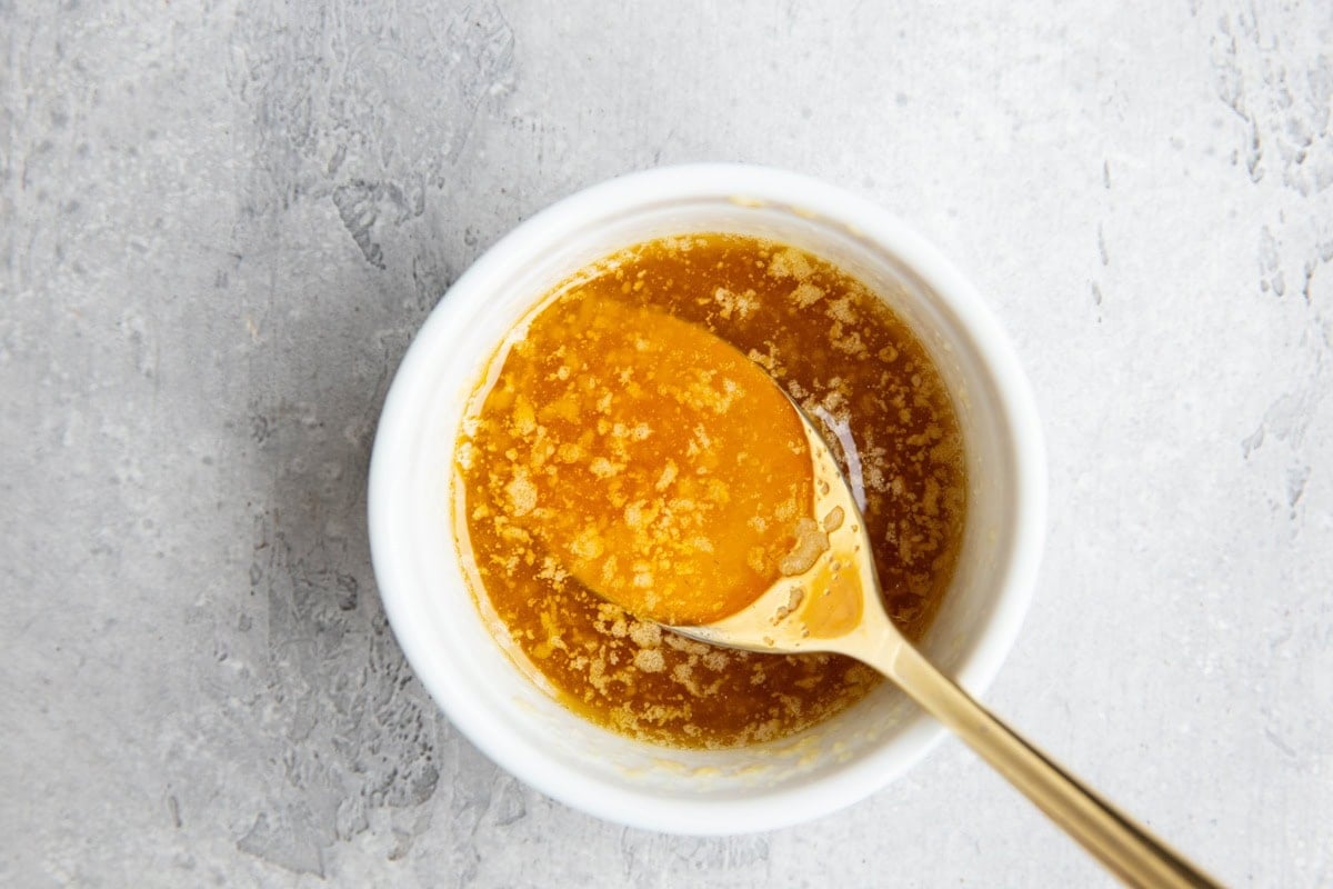 Ramekin with honey butter and garlic.